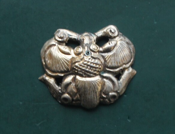 An old silver gilt butterfly flower ornament