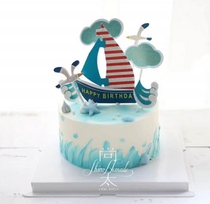 Cake Decorated Birthday Cake with a Smooth Cake inserted through the cake insertion Flag of a large wind and high waves