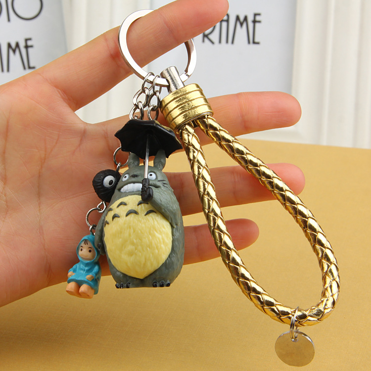 Squat with a raincoat small plum umbrella with a smiley face dragon cat coal ball paparazzi model with rope car key buckle