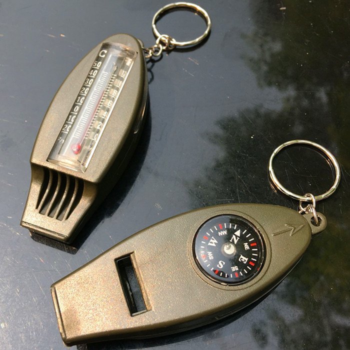 Four-in-one versatile whistleblowing mountain hiking travel begging for a bright set whistle with a compass magnifier thermometer