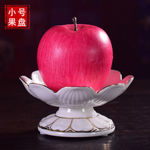 There is a small ceramic lotus fruit plate for the Buddha Guanyin Buddha front tribute plate indoor vintage fruit plate