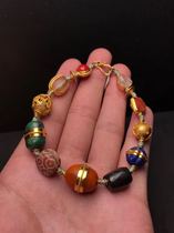 Millennium ancient beads wrapped in gold multi-treasure hand string