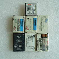 Communication theme old objects electrical nostalgia early Motorola Nokia mobile phone waste batteries seven pieces
