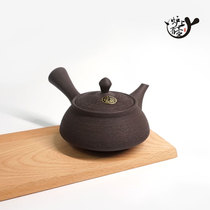 Spot Japan imported Tokoname-yaki human water-made black mud pine skin urgent whisker teapot Japanese tea set There is a pot of tea on the stove