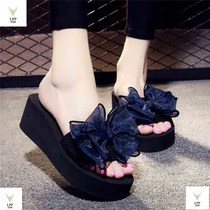 Summer cool slippers Womens bow slippers High-heeled word drag non-slip slope heel thick bottom beach shoes outside the sea