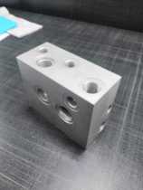 Automotive tailboard power unit hydraulic station valve block