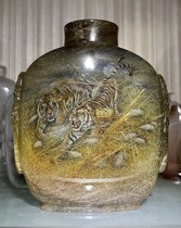 The natural blonde crystal inside the painting snuff pot tiger.