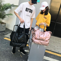 Hand bag mens large capacity Korean version of tide clothes bag light can be carried on the planes travel bag folding can pull rod