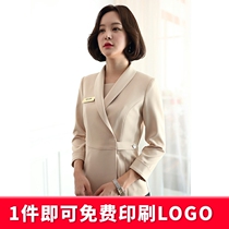 High-end professional suit fashion beautician professional dress woman at the front desk of Hong Kong Miqiu Winter Hotel