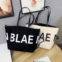Simple one-shoulder women's bag 2020 new letter canvas bag large capacity Korean messenger bag art student bag