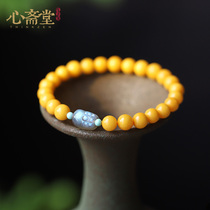 Xin Zhaitang (a while) natural chicken oil yellow beeswax beads hand string Moonlight stone brave bracelet simple jewelry female