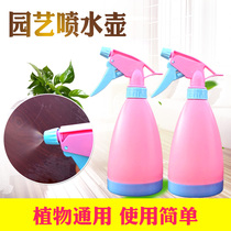 The garden artist uses a sprinkler jug gas pressure sprayer watering the watering spray jug small water spray jug small pressure watering spray bottle