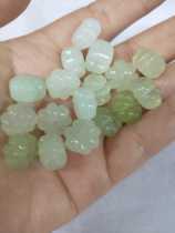 A small nest of jade beads with a small nest of melon jade beads