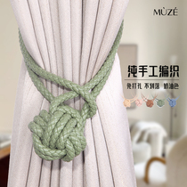 Curtains tied to a pair of clothing free of slipping and not slipping into the net red milk oil color light lavish and upscale and adorned with accessories.