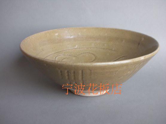 (Song Dynasty: Tongan Kiln: Green Glaze Carved Flower Bowl)