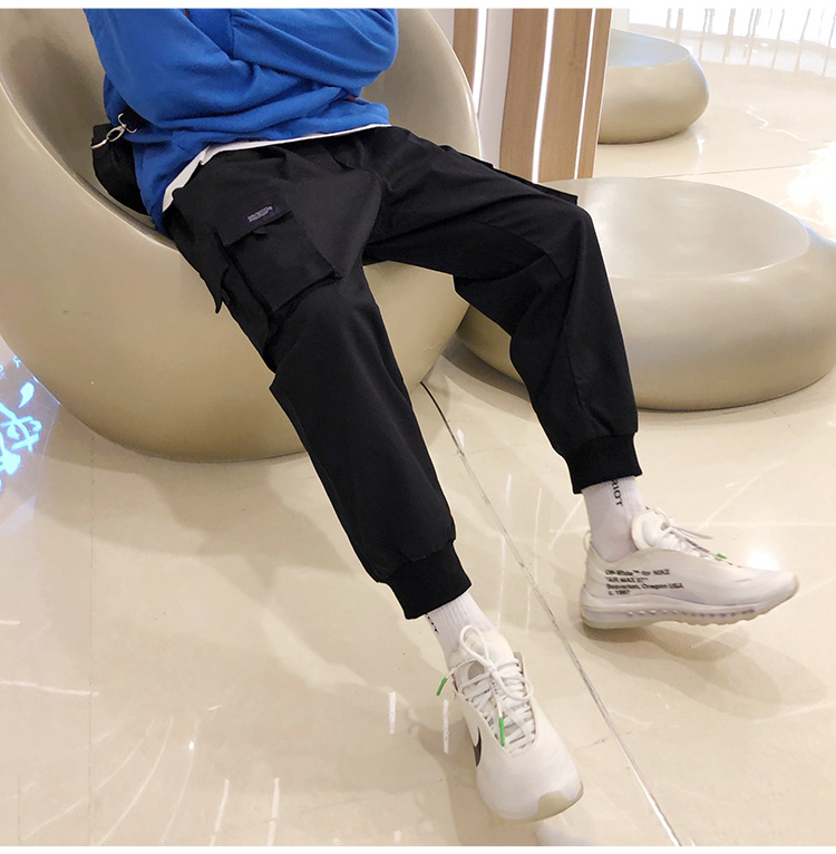 Wozi mùa thu mới màu rắn nhiều túi chùm chân overalls trẻ trung quần lỏng giản dị quần Hong Kong phong cách hoang dã quần baggy nam
