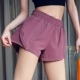 Quần short thể thao nữ chống mục tiêu lỏng lẻo phiên bản Hàn Quốc của quần lửng hai mảnh giả khô nhanh chóng chạy quần nóng quần yoga đỏ - Quần thể thao quần gym