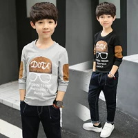 Mùa xuân và mùa thu trẻ em áo sơ mi cotton cotton Quần áo trẻ em châu Âu và Mỹ Áo phông mùa thu dài tay khủng long trẻ em áo phông dài áo phông sành điệu cho bé trai