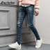Quần jeans nam mùa thu Gurbaks phiên bản Hàn Quốc của quần thời trang Slim quần nam có lỗ thun nam quần jeans nam Quần jean