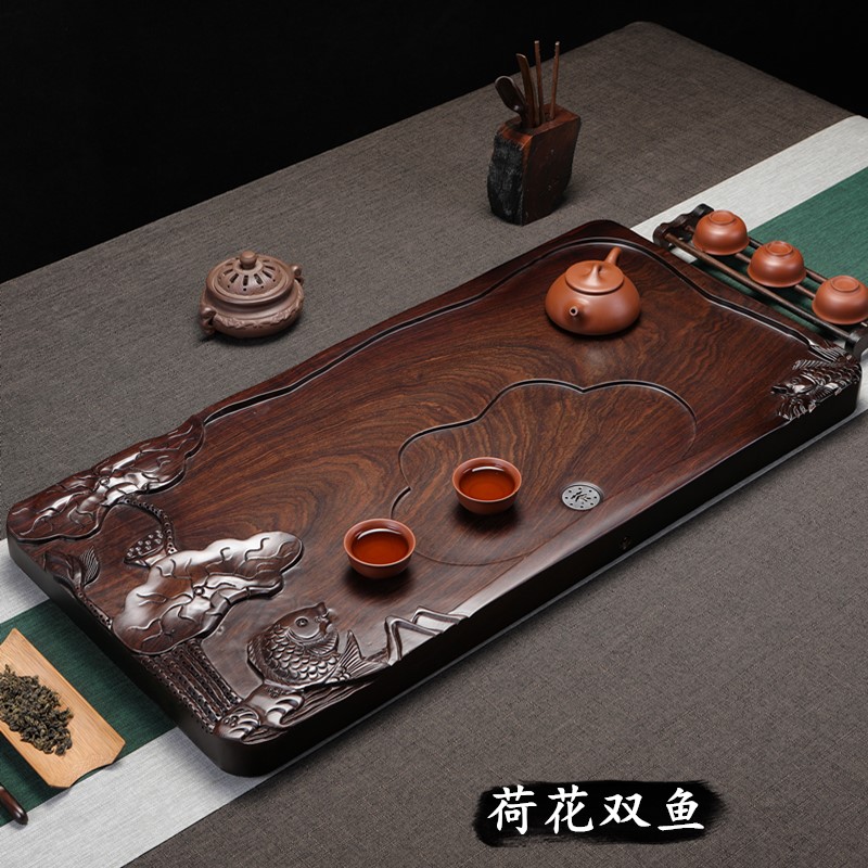 Whole ebony tea tray Household solid wood tea sea carving Simple drainage log tea table Kung Fu tea set