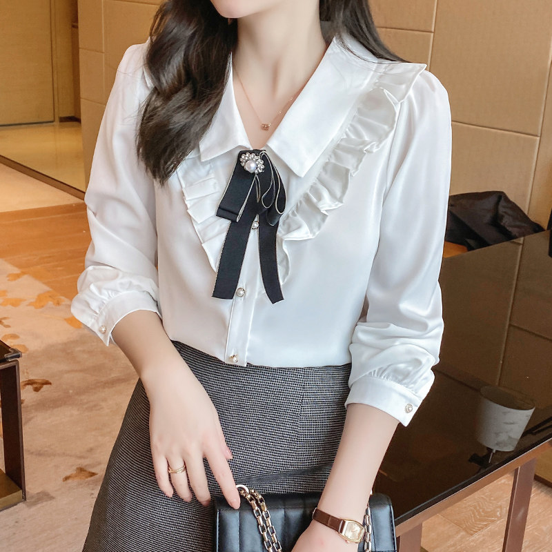 2022 Summer new white dolt collar shirt woman design sensation small crowdsourced lotus leaf side shirt butterfly knot blouse