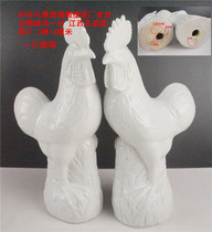 A pair of white-glazed standing roosters from the Jingdezhen Sculpture Factory in the 1980s 31.5 cm high slightly embossed with factory inscription.