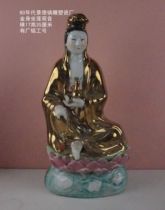 An old piece from the Jingdezhen Sculpture Factory in the 1980s a golden statue of Guanyin sitting on a lotus 35 cm high with a factory inscription.
