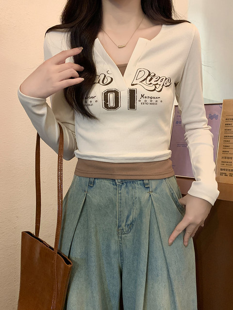 Distressed Letter Print Color-Blocked Fake Two-Piece Women's 2026 Spring New American Style Spicy Girl V-Neck Long-Sleeve T-Shirt Top