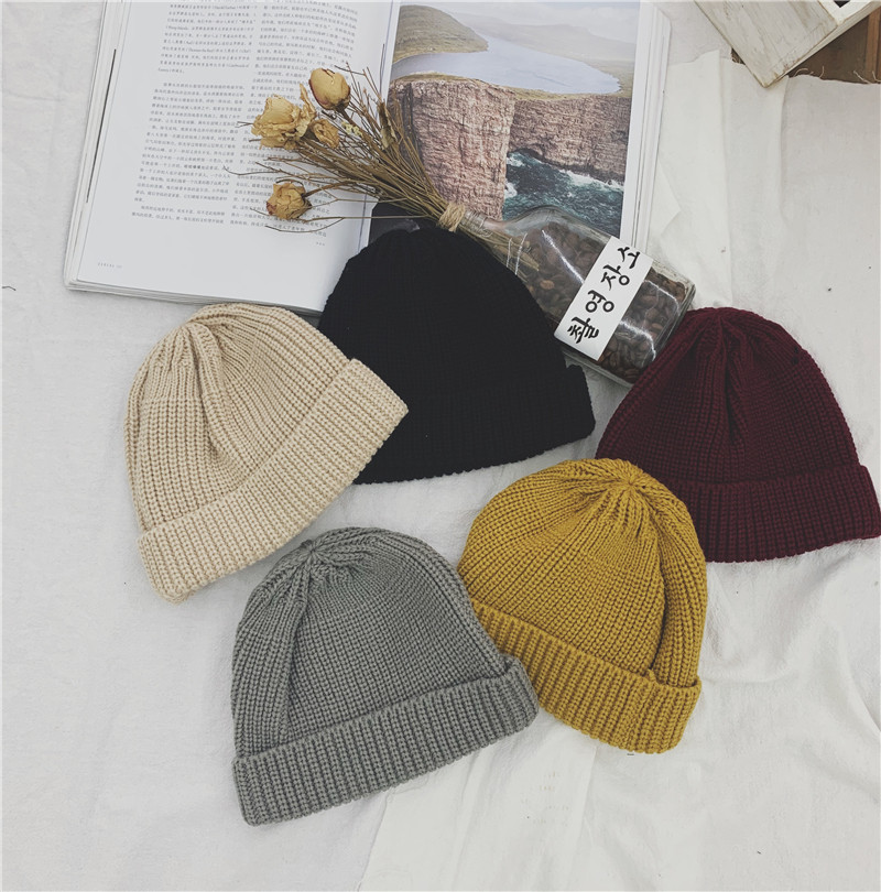 Baby autumn and winter solid color Western style knitted wool caps boys and girls warm pullovers ear protection caps children's curling Baotou caps