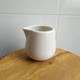 Simple ceramic bottle ceramic jar egg-shaped pointed mouth water drop coffee milk cup milk pot Western food sauce sauce jar milk cup