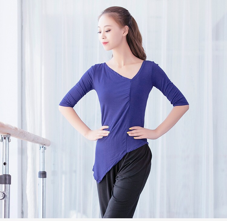 Modale V leads classical modern Latin dance practice with irregular cover with long sleeve blouse female teacher adult