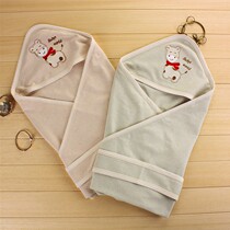 All-cotton baby bag held by newborn cuddled with pure cotton wrap wrapped in cloth baby colored cotton swaddle