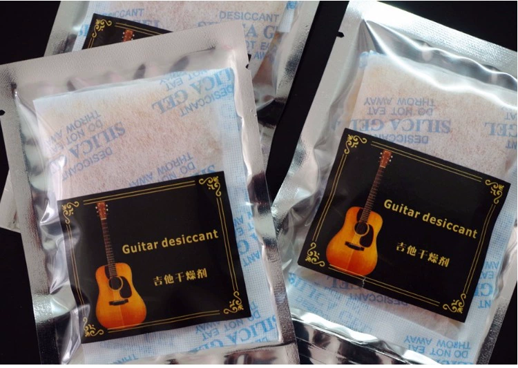 Nhạc cụ đàn guitar hút ẩm gói âm thanh lỗ hộp ukulele đàn piano hấp thụ ẩm hút ẩm khuôn nứt - Phụ kiện nhạc cụ