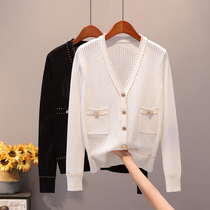Knitted cardigan 2021 spring and autumn new loose white jacket hollow short section match foreign style early spring thin sweater women
