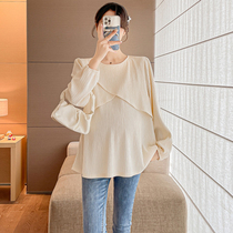 Spring and Autumn long-sleeved maternity shirts Korean style niche design crossover tops belly-covering and slimming baby tops during pregnancy trendy