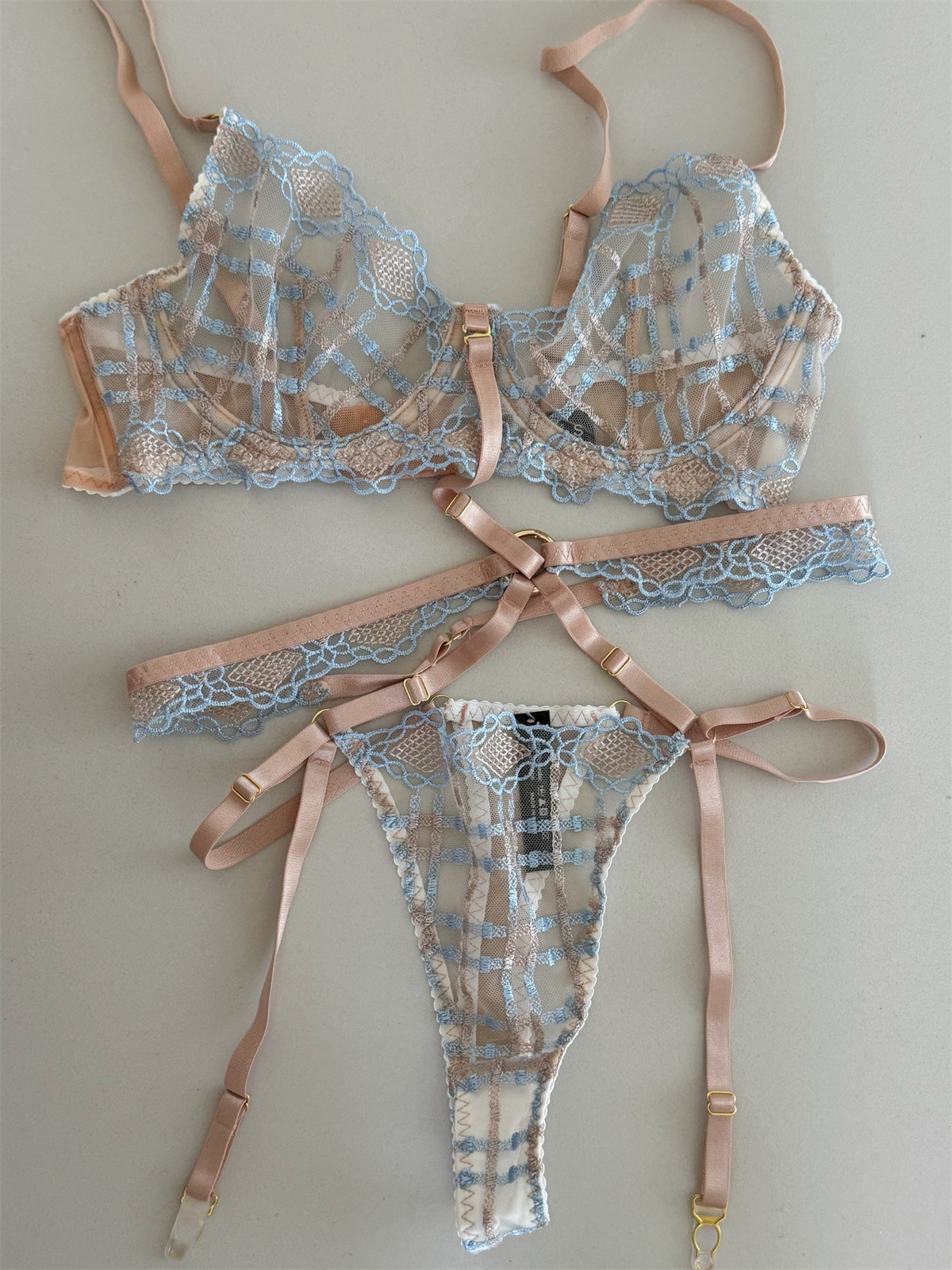 Push up bra set with patchwork lace cups, matching thong, and adjustable straps
