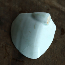 Fragment of a celadon-glazed celadon-white porcelain pot from the Hutian kiln in the Song Dynasty