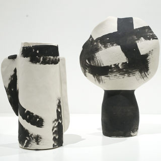 Hot-selling craftsman-shaped ceramic decorative vase ornaments simple modern creative black and white ceramic vase and flower ware soft decoration sample