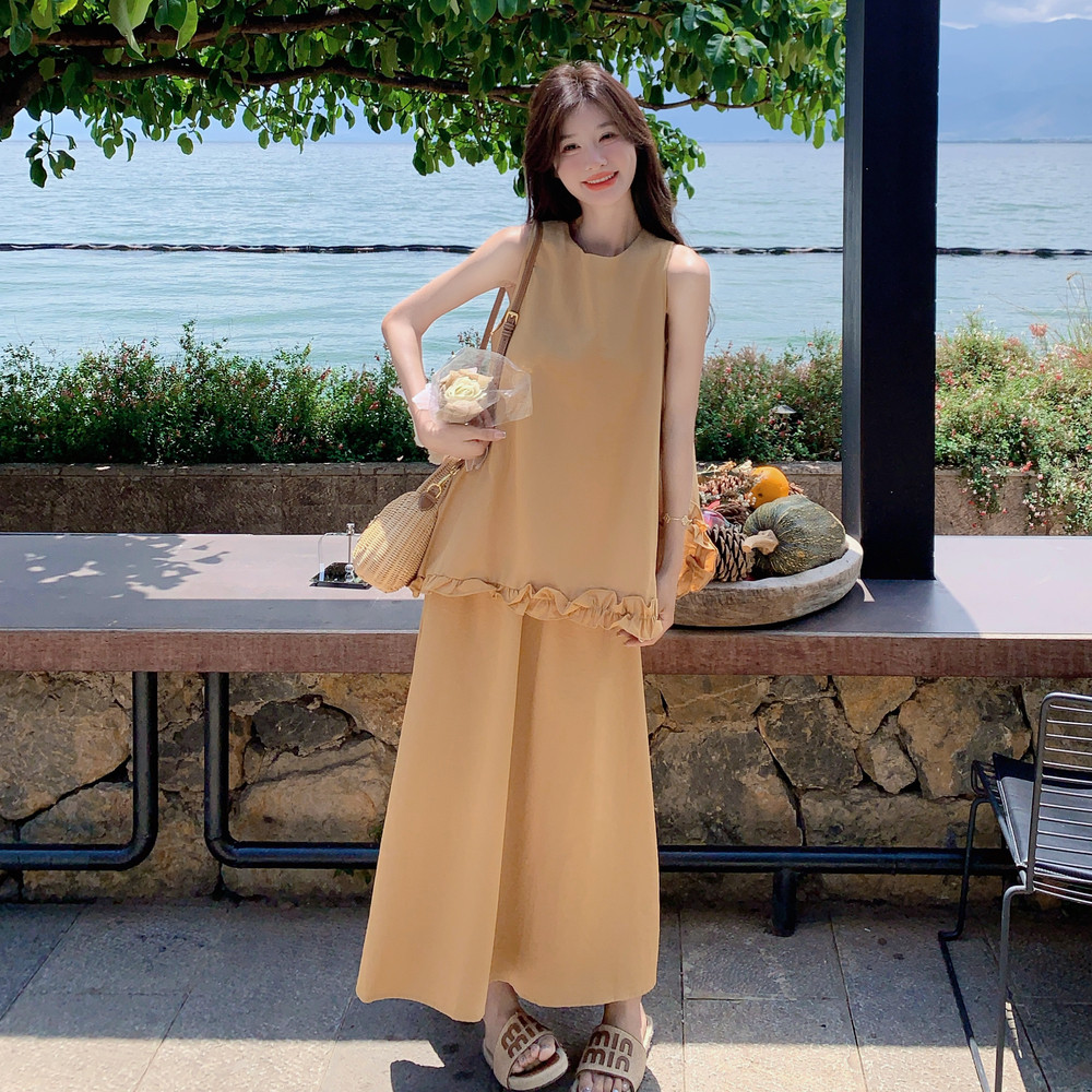 多巴胺度假风穿搭黄色无袖套装女夏超火好看绝美背心半身裙两件套图片