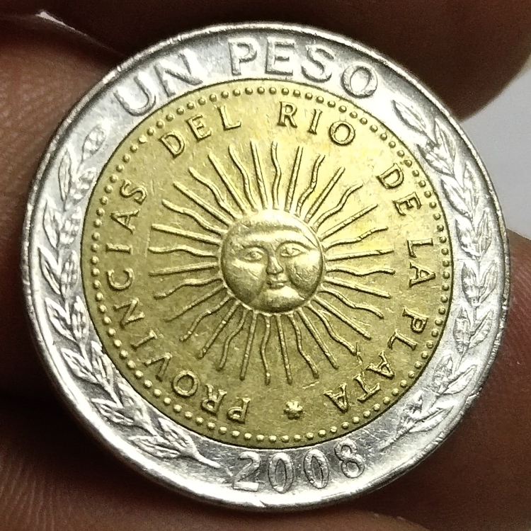 (arbitrarily full RMB30 ) Argentinian sun god 1 peso bicolor coin foreign coin old product 7026