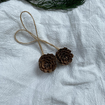 Natural mini pine cones about 2cm to 3cm with a sling is true