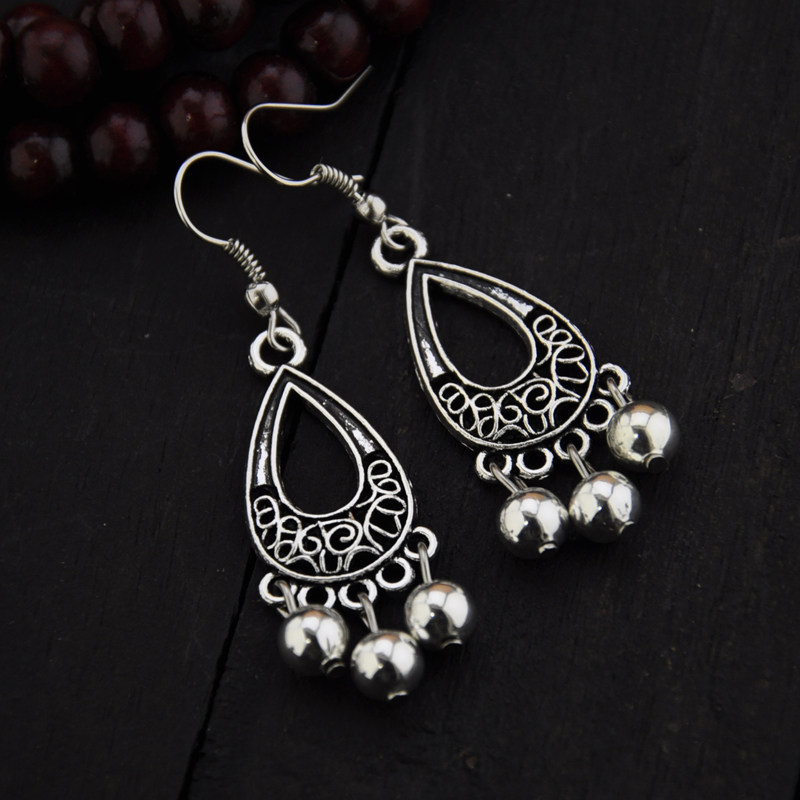 Ancient ear ornaments national style hollow miao silver peacock brand classical patterned earrings women's original jewelry Korean version temperament