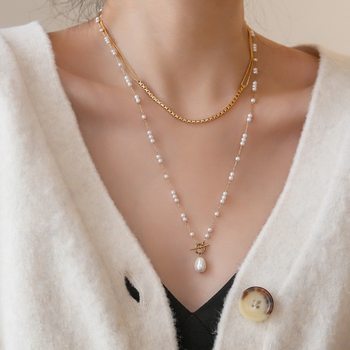 The new gentle light luxury niche freshwater pearl OT buckle long necklace female temperament design sense of advanced Tanabata