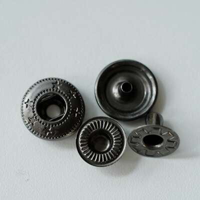 A pair of 14mm, made in China, British Merchant and mills copper barrel gray metal snap fasteners