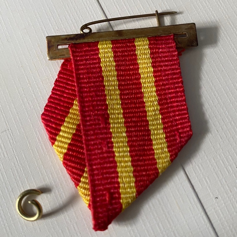 Remembrance of the badge with a badge on the badge.