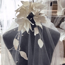 Megos original and elegant handmade white magnolia branches bridal headwear and makeup styling photo shoot on location and travel