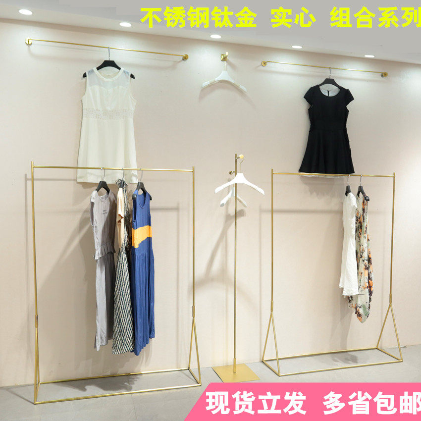Clothing store hanger floor-to-ceiling island rack is hanging solid stainless steel brushed gold display hanger rack