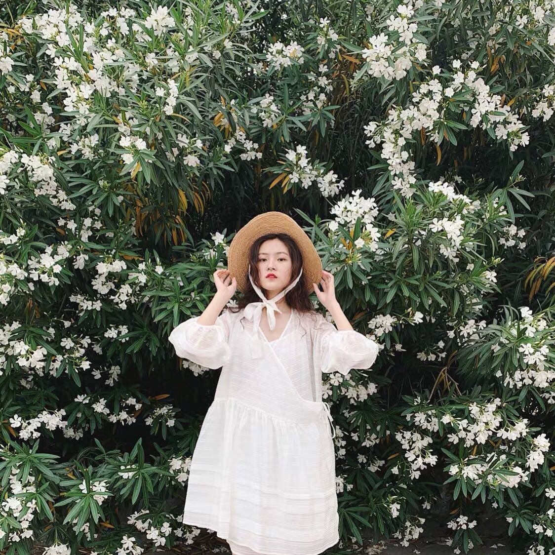 The same summer white lantern sleeve dress with loose doll skirt