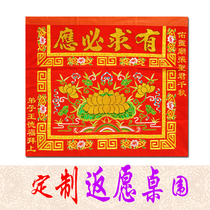 The Buddhist hall is decorated with tables and dresses.