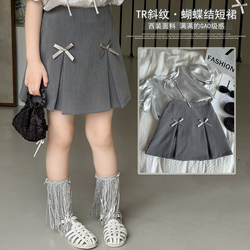 ເຄື່ອງນຸ່ງເດັກນ້ອຍສີຄີມເດັກນ້ອຍເດັກຍິງເກົາຫຼີແບບວິທະຍາໄລແບບກະໂປງ 2024 summer ໃຫມ່ເດັກນ້ອຍ bow A-line skirt